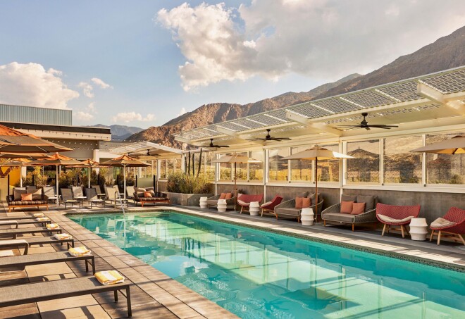 A view of the pool and patio at Kimpton Rowan Palm Springs, California.