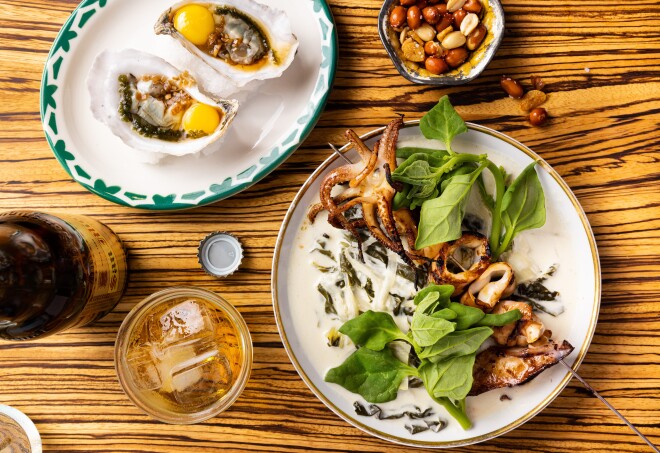 A table with a few seafood dishes from Silver Iocovozzi’s restaurant Neng Jr.’s in Asheville, North Carolina