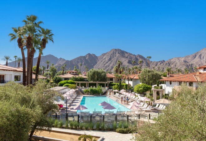 A view of the pool and surrounding desert mountains at Tommy Bahama Miramonte Resort in the Greater Palm Springs, California