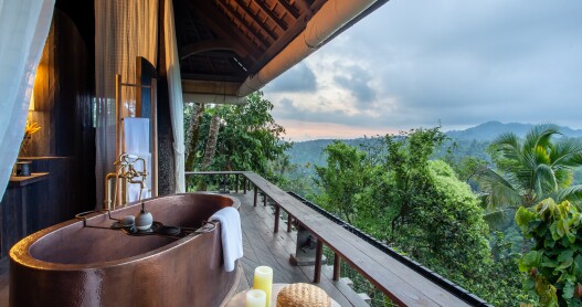 The bathtubs at Buahan, a Banyan Tree Escape face the Balinese jungle.